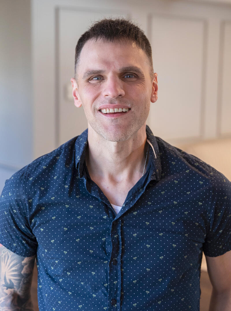 A man in a blue shirt